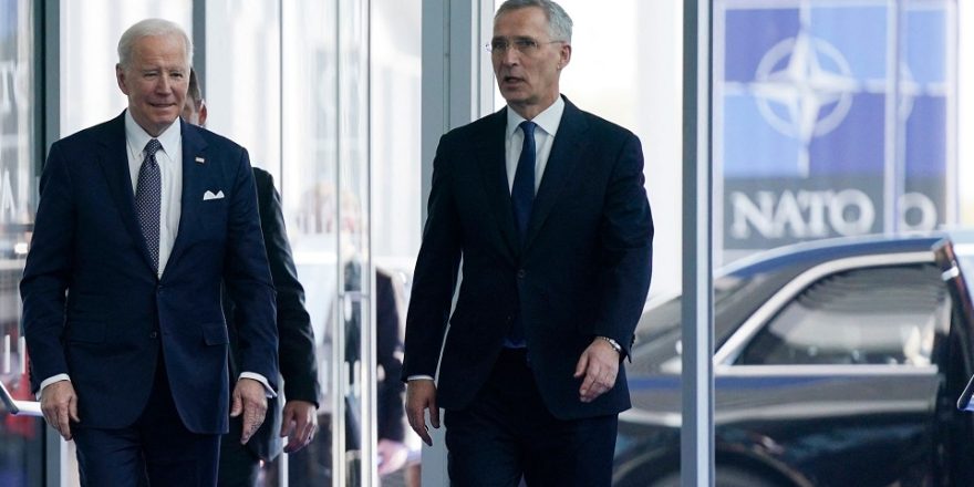 US President Joe Biden (L) walks with NATO Secretary General Jens Stoltenberg as he arrives for an extraordinary summit at NATO Headquarters in Brussels on March 24, 2022. (Photo by Evan Vucci / POOL / AFP) (Photo by EVAN VUCCI/POOL/AFP via Getty Images)